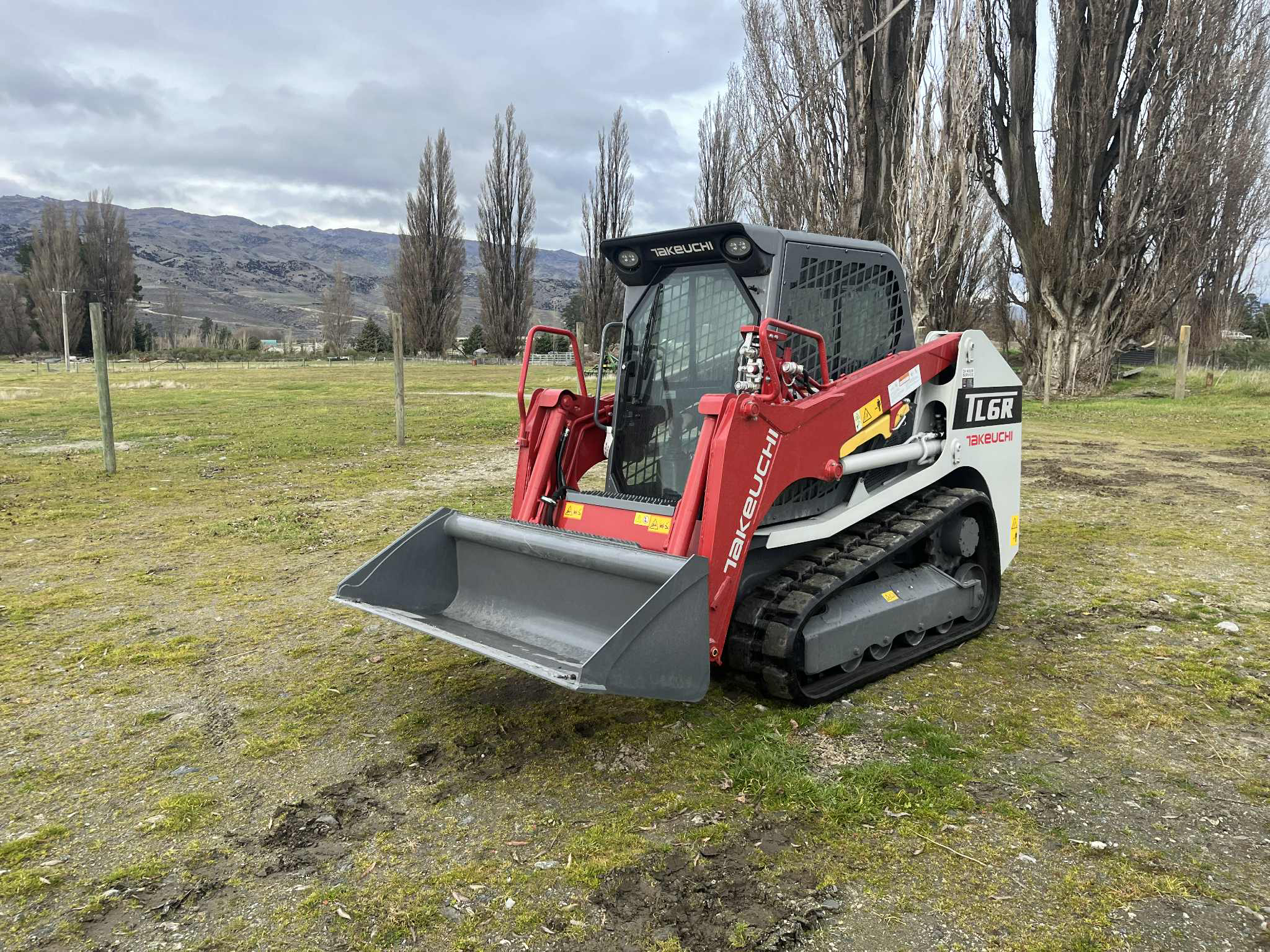 Hire South Takeuchi TL6R tracked skid steer available for self-drive hire or operated contracting in Cromwell, Central Otago